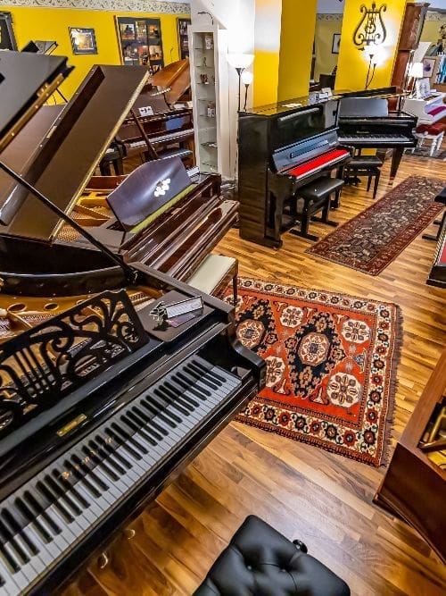 Restored grand pianos in the Musism showroom