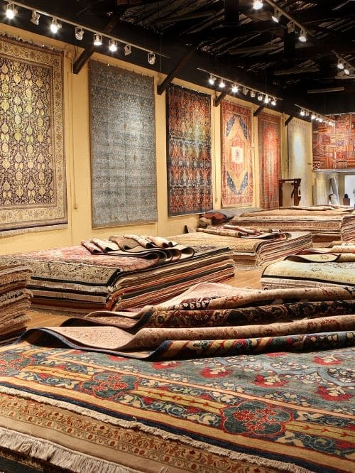 TeppichBazar gallery in Vienna with hanging Persian rugs